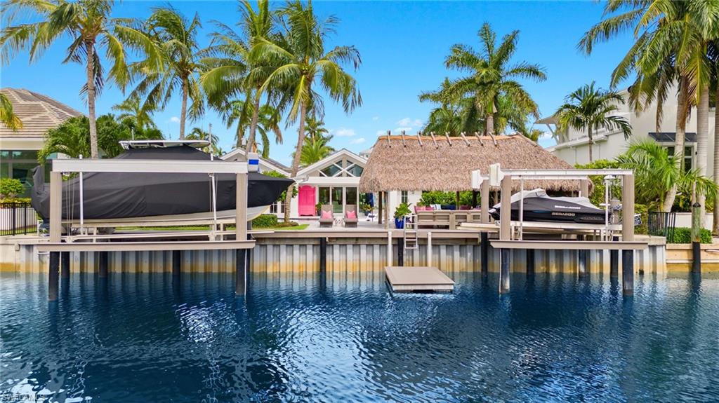1960 Tarpon Road Naples, FL 34102 - Photo 1 of 49 a view of house with swimming pool and view of house