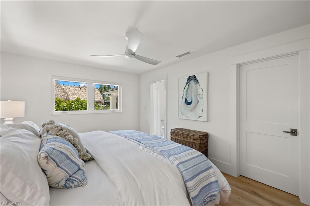 1960 Tarpon Road Naples, FL 34102 - Photo 31 of 49 a bedroom with a bed and a painting on the wall
