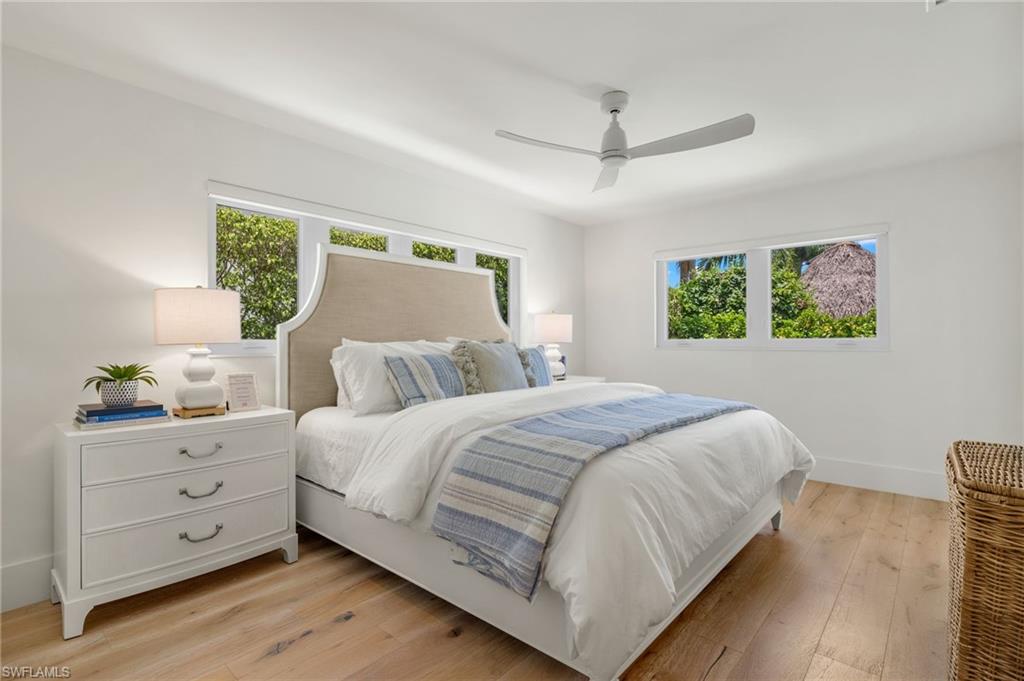1960 Tarpon Road Naples, FL 34102 - Photo 32 of 49 a bedroom with a large bed and a window