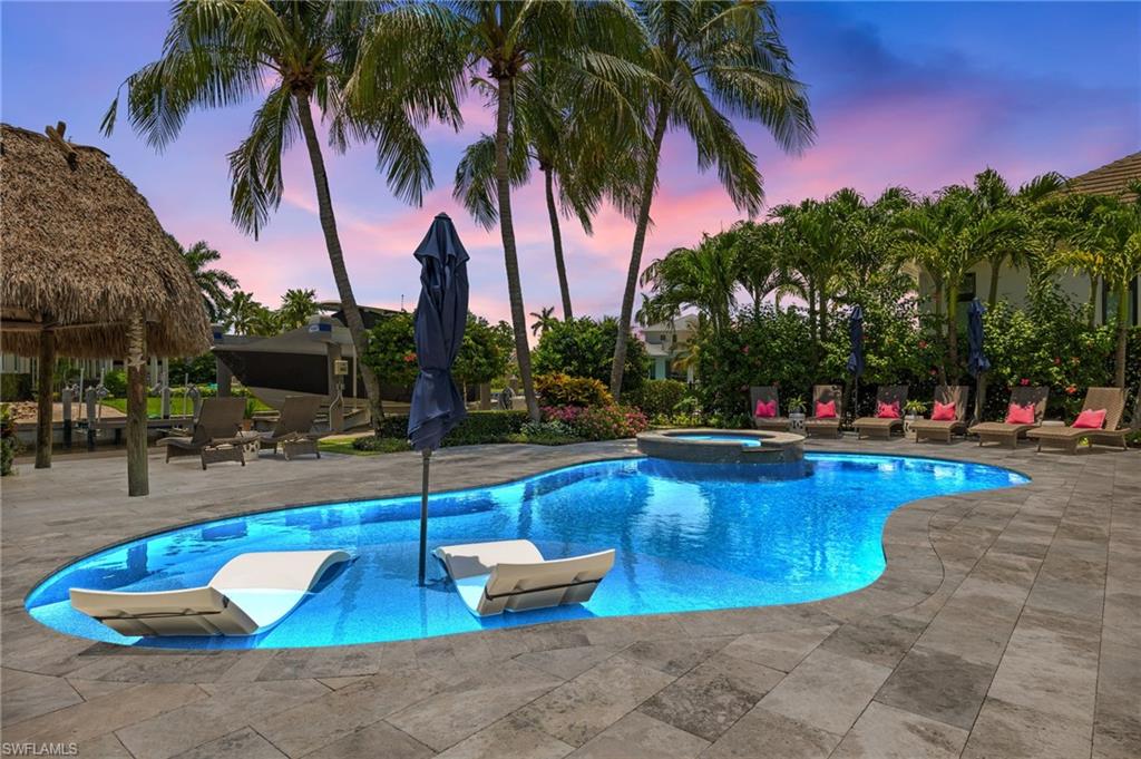 1960 Tarpon Road Naples, FL 34102 - Photo 38 of 49 a view of swimming pool with outdoor seating