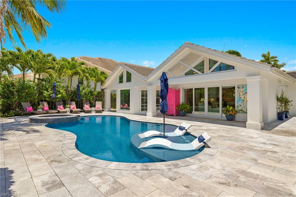 1960 Tarpon Road Naples, FL 34102 - Photo 4 of 49 a view of a house with swimming pool and sitting area