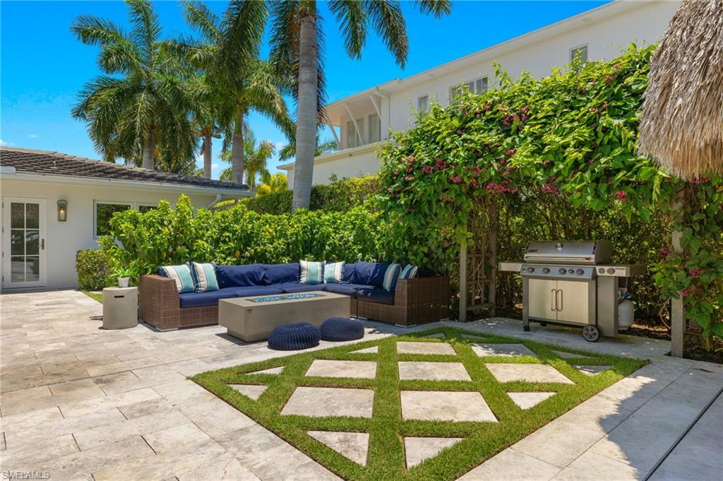 1960 Tarpon Road Naples, FL 34102 - Photo 41 of 49 a view of a backyard with sitting area