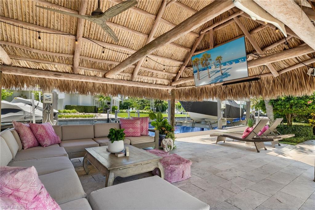 1960 Tarpon Road Naples, FL 34102 - Photo 42 of 49 a outdoor living space with patio furniture and a potted plant