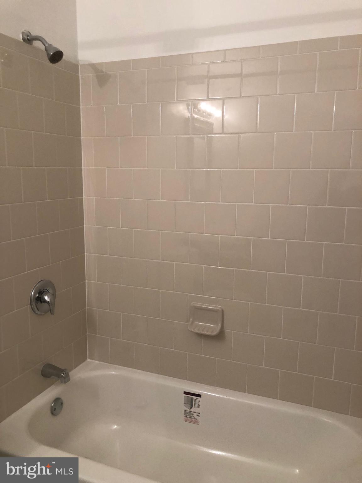 13127 Haddock Road Woodbridge, VA 22193 - Photo 18 of 24 New Neutral tile tub/shower