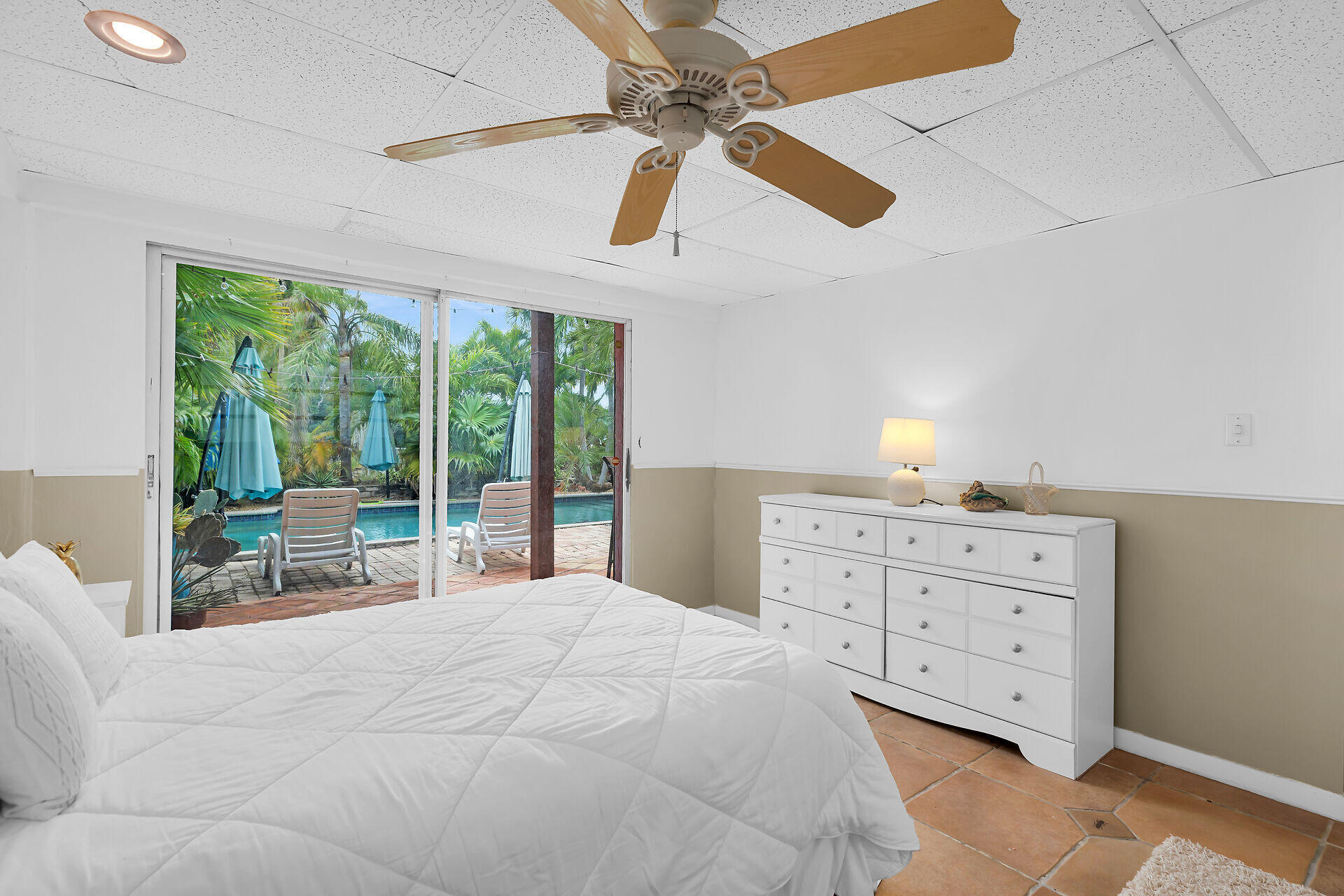 42 Treasure Road Marathon, FL 33050 - Photo 34 of 70 a spacious bedroom with a large bed and a window