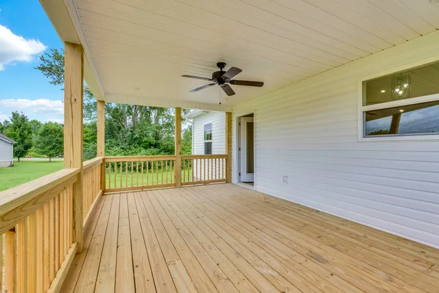 a view of a balcony with a ceiling fan