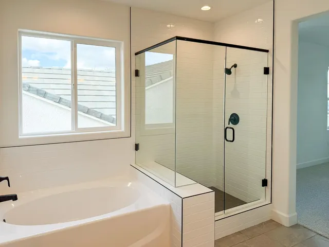 a bathroom with a bathtub and a shower