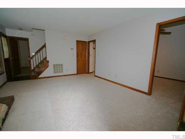 6804 Chamonix Place Raleigh, NC 27613 - Photo 3 of 12 a view of an empty room with stairs