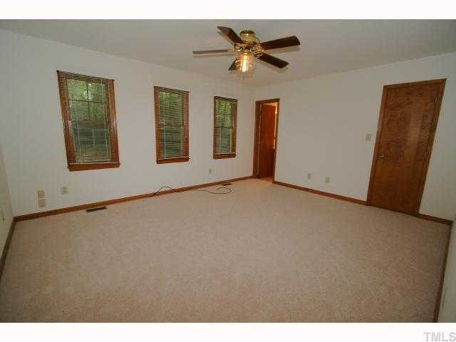 6804 Chamonix Place Raleigh, NC 27613 - Photo 6 of 12 a view of an empty room with a window