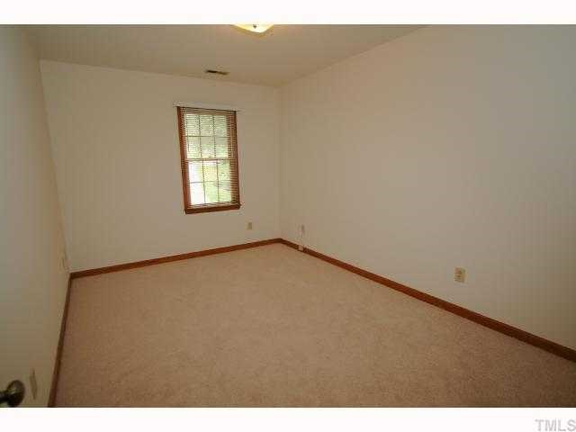 6804 Chamonix Place Raleigh, NC 27613 - Photo 8 of 12 a view of an empty room and window