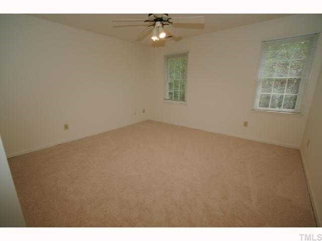 6804 Chamonix Place Raleigh, NC 27613 - Photo 9 of 12 a view of an empty room with a window