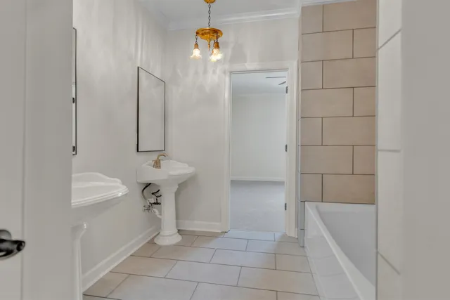 an empty room with window and wall painting