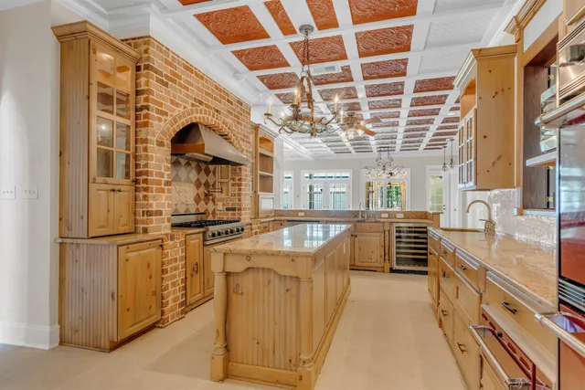 a kitchen with stainless steel appliances granite countertop a stove and a refrigerator