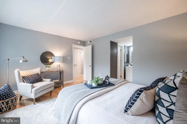 a bedroom with bed and a couch