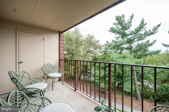 a balcony with chairs