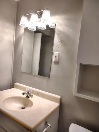 a bathroom with a sink and a mirror