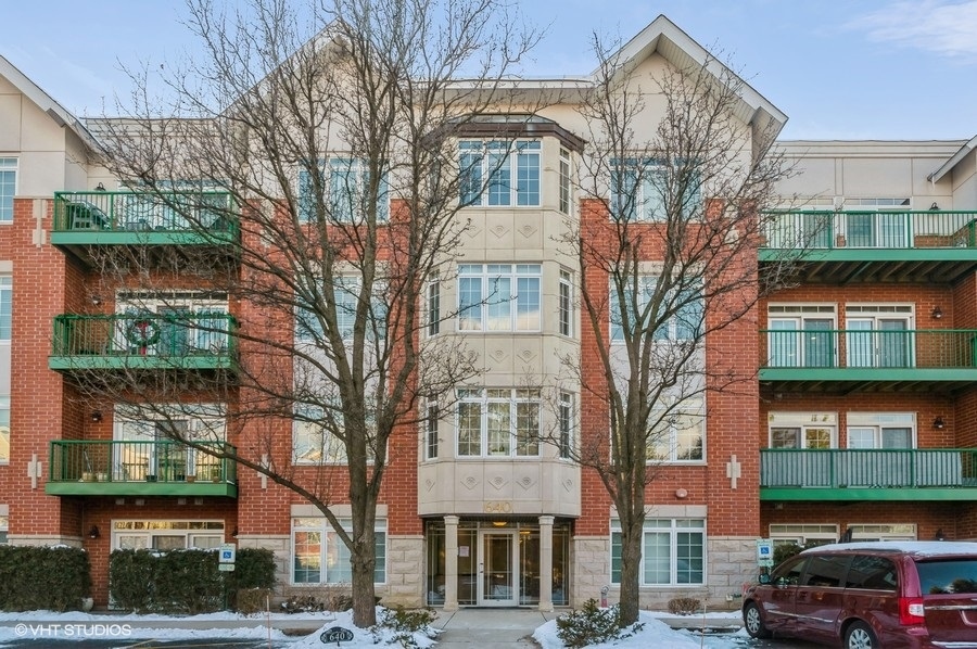 a city street lined with buildings and cars