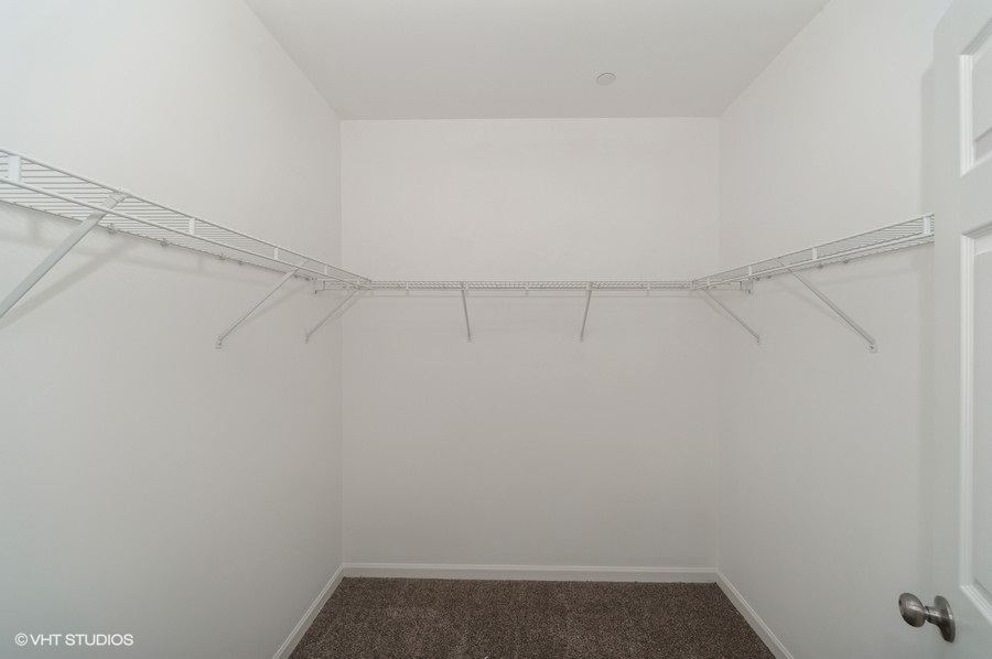 640 McHenry Road, Unit 203 Wheeling, IL 60090 - Photo 8 of 14 a view of a room with racks on the wall