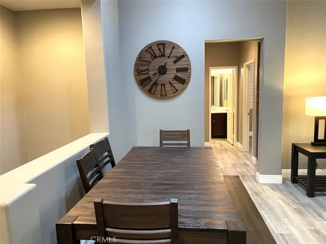 a view of a livingroom with furniture and wooden floor