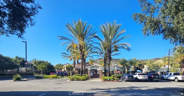 a view of a street with retail shops