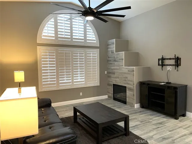 a living room with furniture and a fireplace