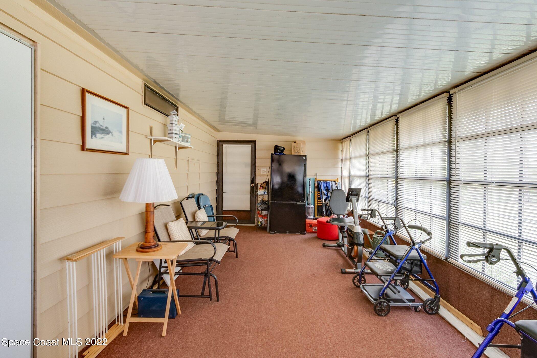 1990 Mango Street Northeast Palm Bay, FL 32905 - Photo 29 of 53 Enclosed porch/Family room