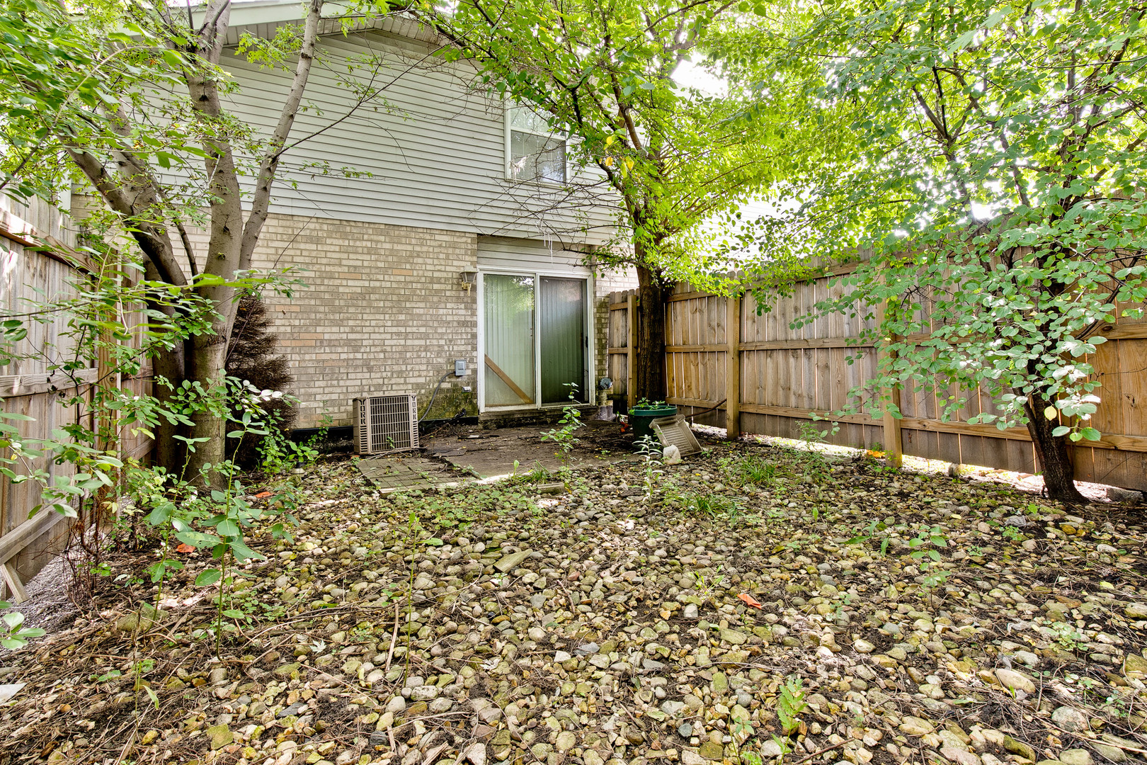 5505 West Cal Sag Road Alsip, IL 60803 - Photo 14 of 14 a view of a backyard with potted plants and large tree