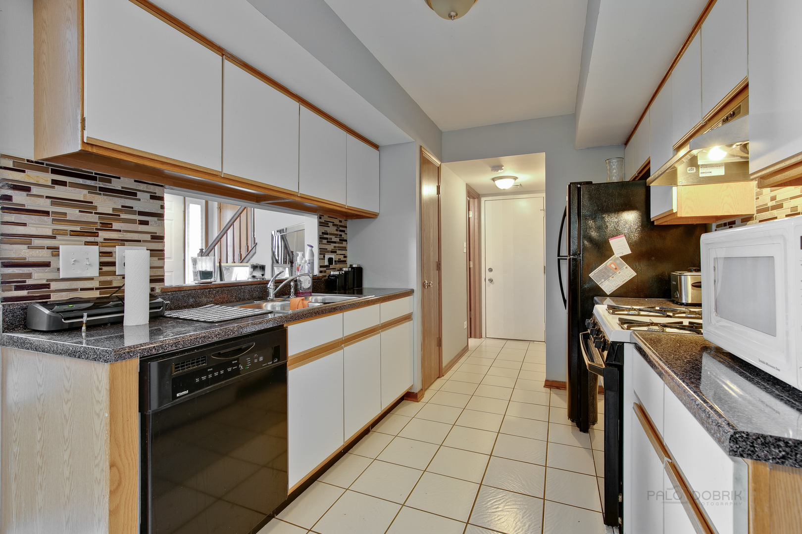 5505 West Cal Sag Road Alsip, IL 60803 - Photo 6 of 14 a kitchen with stainless steel appliances a stove sink and cabinets