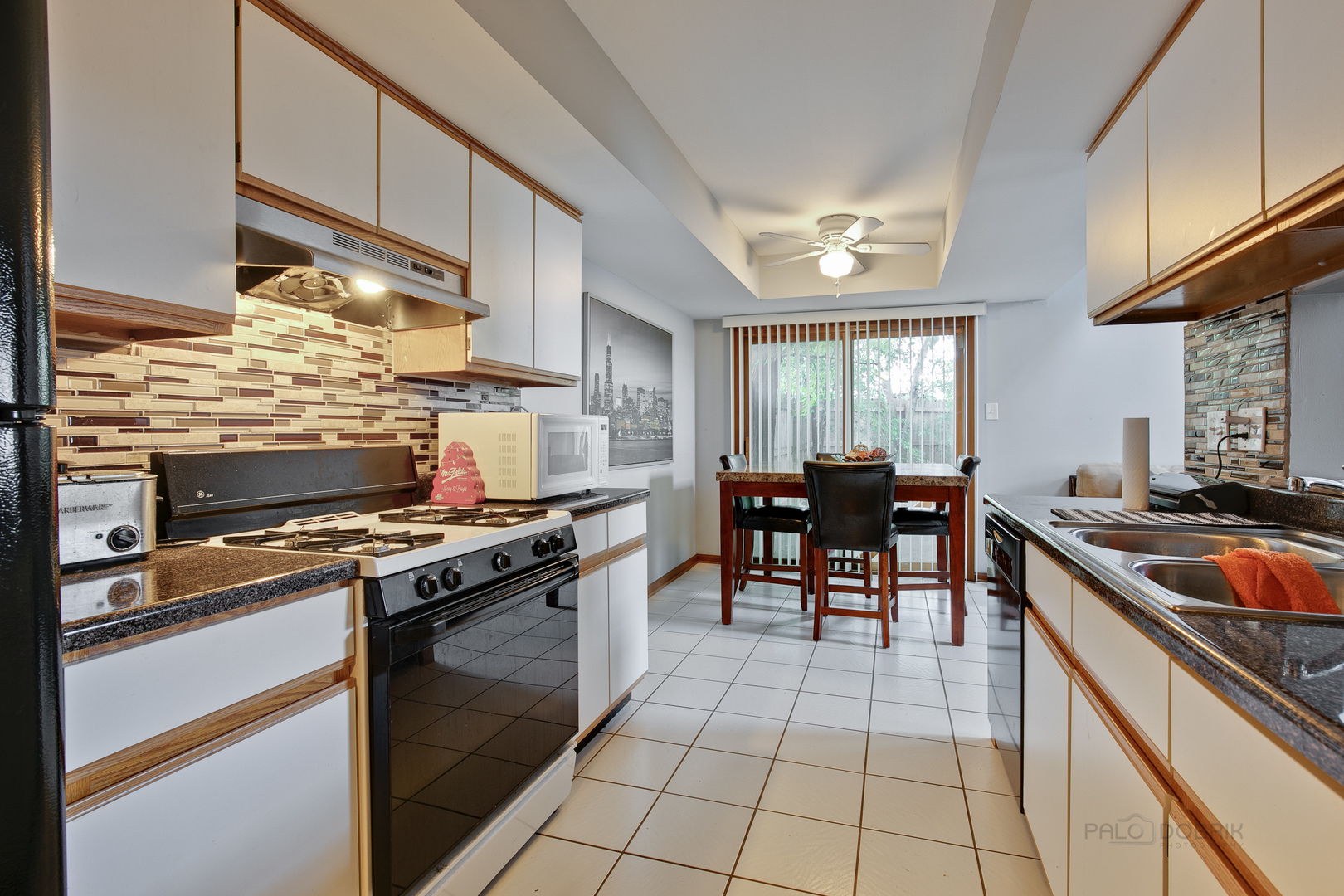 5505 West Cal Sag Road Alsip, IL 60803 - Photo 7 of 14 a kitchen with stainless steel appliances granite countertop a stove a sink and a refrigerator