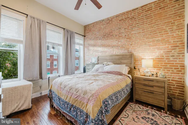 a picture of a room with a white wall and a mirror