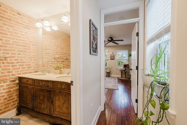 a living room with furniture a rug and a large window