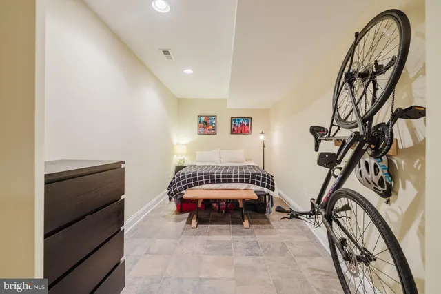 a blue couch sitting in a living room with a couch