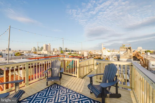 a view of a balcony with chairs
