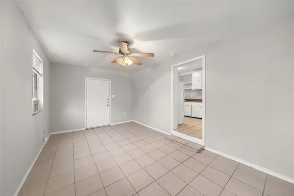 a view of an empty room with a window