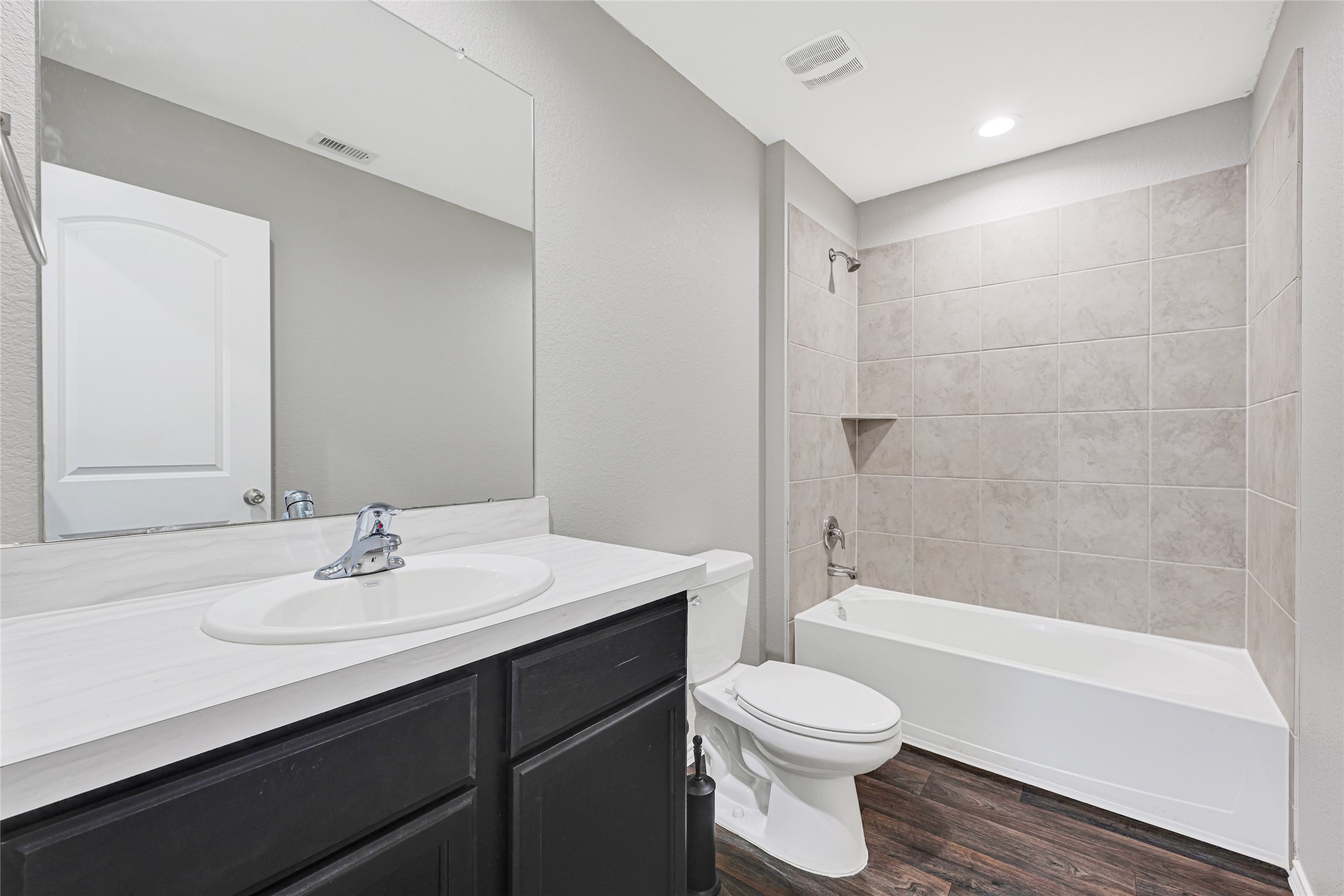 22438 Forest Gorge Lane Spring, TX 77373 - Photo 13 of 20 a bathroom with a sink a toilet and shower
