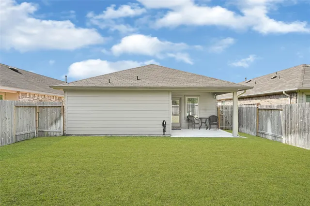 a front view of house with yard and seating area