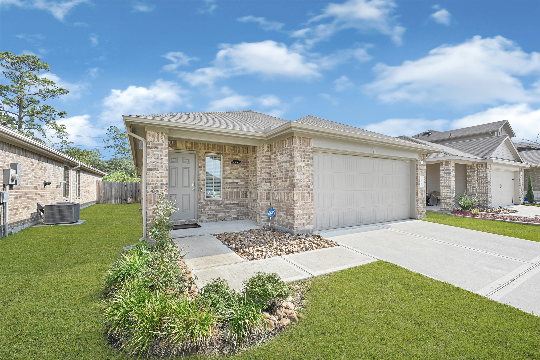22438 Forest Gorge Lane Spring, TX 77373 - Photo 2 of 20 a front view of a house with garden