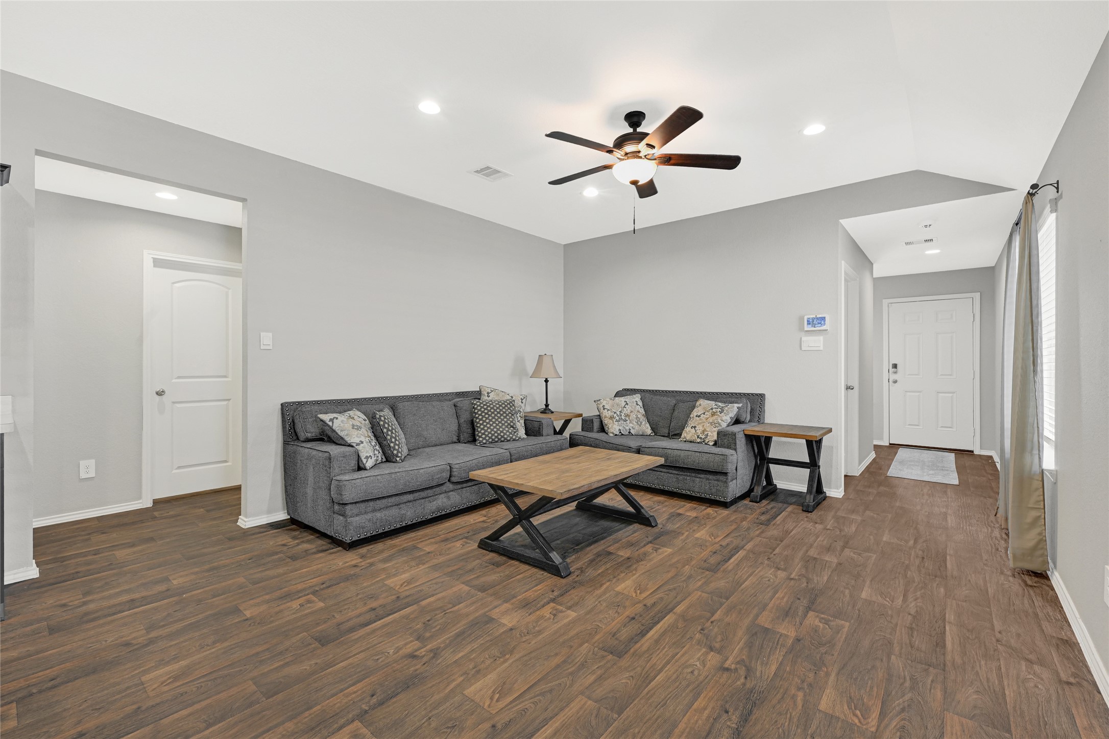 22438 Forest Gorge Lane Spring, TX 77373 - Photo 7 of 20 a living room with furniture and a wooden floor
