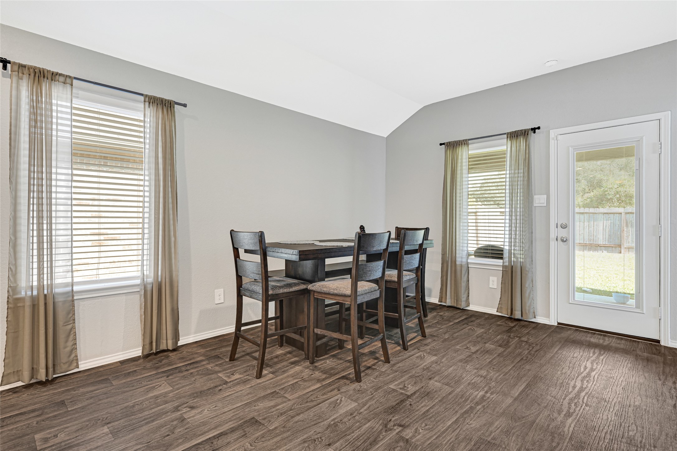22438 Forest Gorge Lane Spring, TX 77373 - Photo 9 of 20 a view of a dining room with furniture and wooden floor