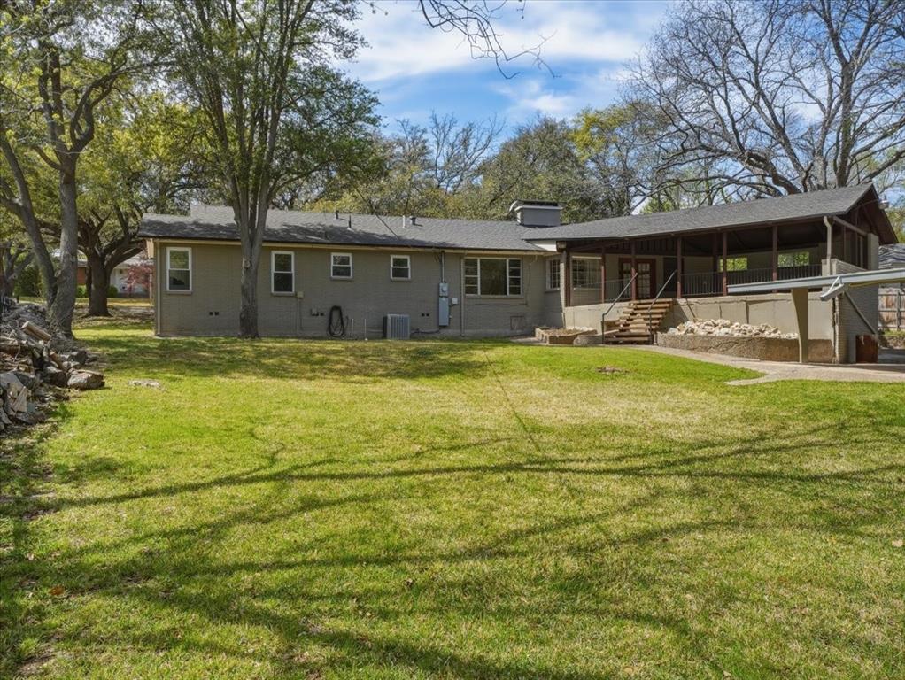 3863 Clayton Road East Fort Worth, TX 76116 - Photo 36 of 39 a view of a house with swimming pool next to a yard
