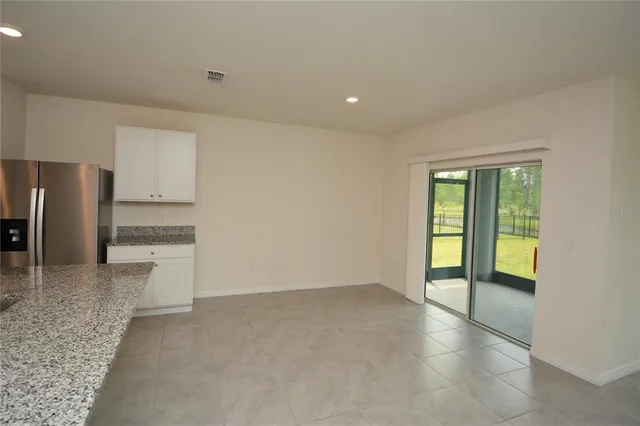a view of a kitchen with a sink and dishwasher a refrigerator with a dishwasher