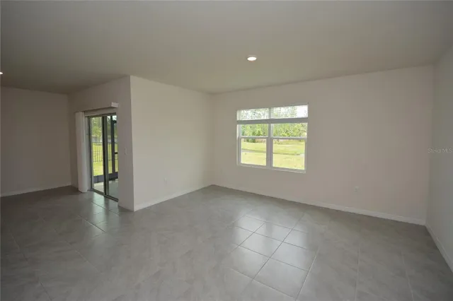 a view of kitchen with stainless steel appliances kitchen island refrigerator sink and stove