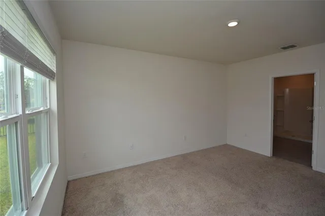 a bathroom with a granite countertop sink mirror and shower