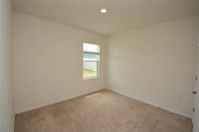 a bathroom with a granite countertop sink a toilet and bathtub