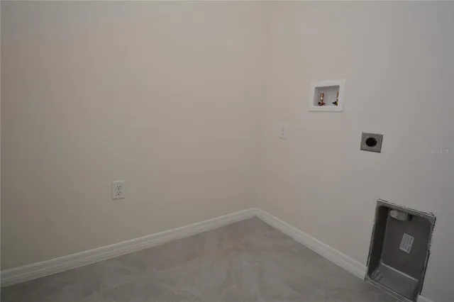 a view of a house with a yard and plants