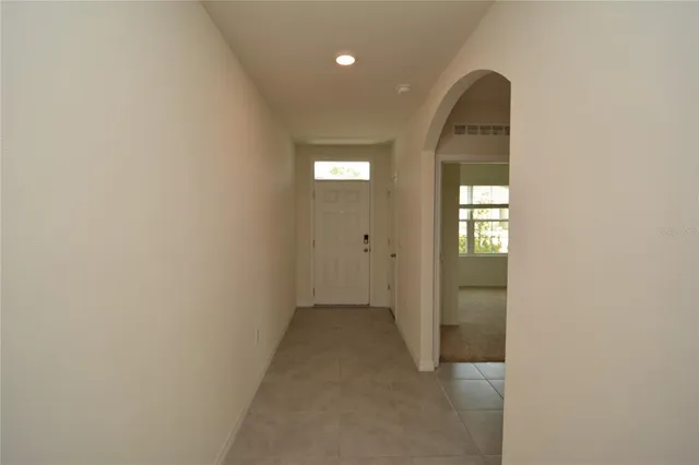 a kitchen with stainless steel appliances granite countertop a sink and a refrigerator