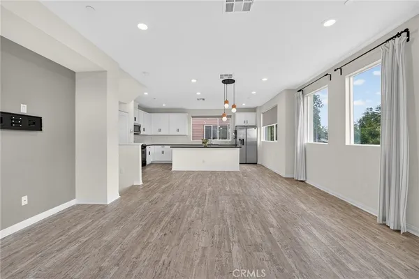 a view of kitchen with wooden floor