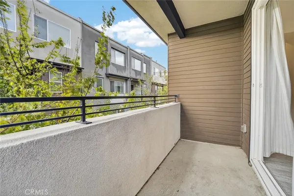 a kitchen with granite countertop a stove top oven sink and cabinets