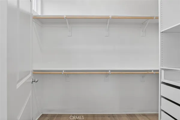 a bathroom with a double vanity sink toilet and mirror