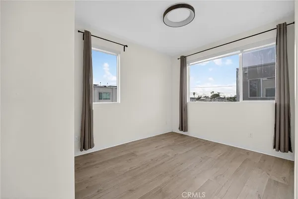 a view of hallway with wooden floor